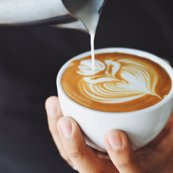 Coffee shops Palm Coast - laptop and coffee at local cafe for remote work