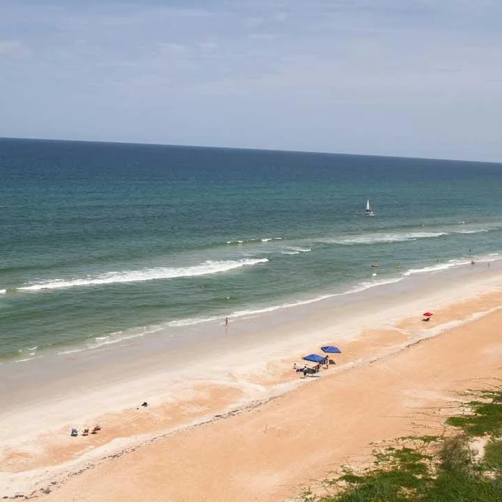 People enjoying the beach on Ormond Beach Florida