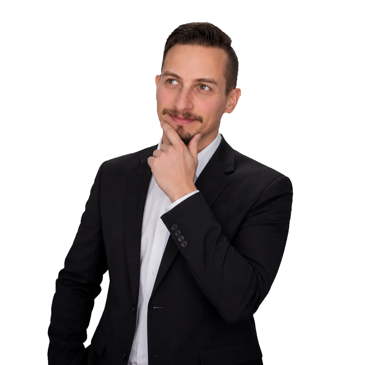 Patrick Domingues, CEO and Founder of Zevonix, in a thoughtful business portrait wearing a black suit and white dress shirt.